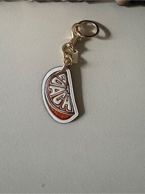 Coach Orange charm